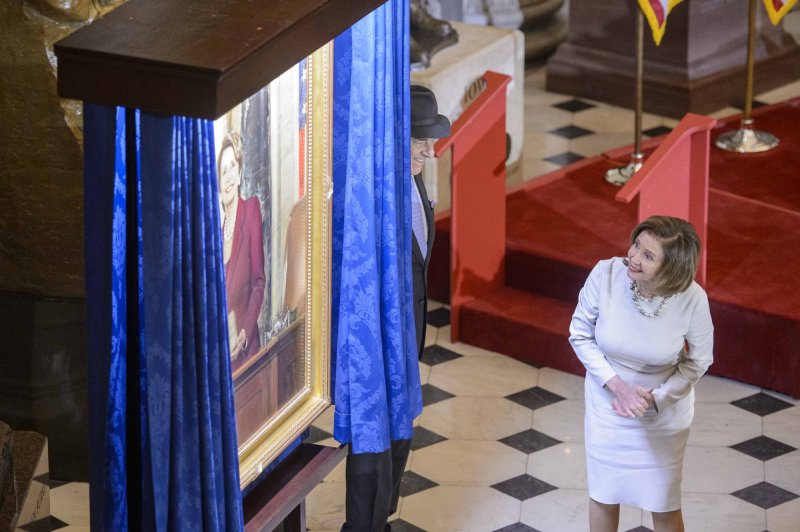 Speaker of the House Nancy Pelosi, D-Calif., admires her portrait as her husband, Paul Pelosi, looks on during a ceremony in Statuary Hall at the U.S. Capitol in Washington, D.C., on Wednesday. Pelosi is the first female speaker of the house. Photo by Bonnie Cash/UPI | <a href="/News_Photos/lp/aa921ce11034bd6f5de55cd17c2fcadb/" target="_blank">License Photo</a>