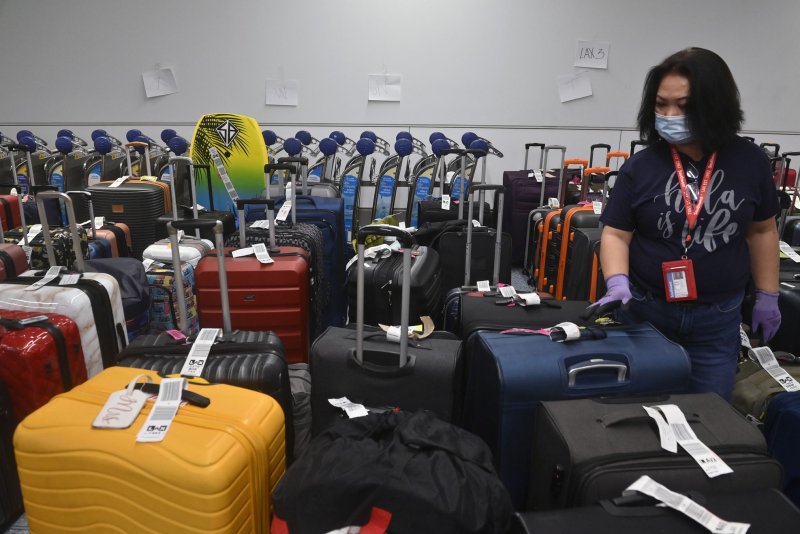 Hundreds of pieces of luggage await to be claimed by their owners at the Southwest Airlines terminal at Los Angeles International Airport on Tuesday. The airline canceled the majority of its flights again on Wednesday. Photo by Jim Ruymen/UPI | <a href="/News_Photos/lp/233cd2a1df191e5221d31bb3b08ea306/" target="_blank">License Photo</a>