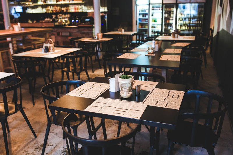 A recent study found that climate impact menu labels were effective at encouraging more sustainable food selections. Photo by kaboompics/<a href="https://pixabay.com/photos/table-chairs-chair-restaurant-791167/">Pixabay</a>