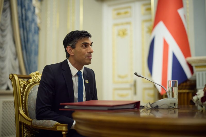 British Prime Minister Rishi Sunak meets at the Ukrainian capital Kyiv on November 19. His government won approval to continue deporting refugees to Rwanda by its High Court on Monday. Photo by Ukrainian President's Office/UPI