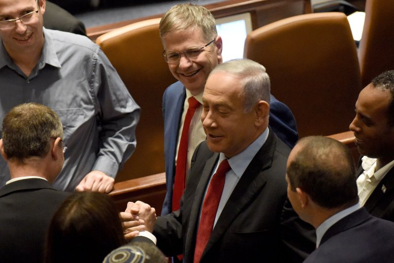 Benjamin Netanyahu (C) has submitted coalition agreements ahead of his new government being sworn in, one of which promotes annexation in the West Bank. File Photo by Debbie Hill/UPI | <a href="/News_Photos/lp/f49fbae16d08915499993489619dd850/" target="_blank">License Photo</a>