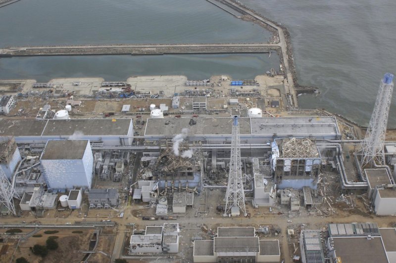 The crippled Fukushima Dai-ichi nuclear power plant is seen in Okumamachi, Fukushima prefecture, in northern Japan on March 20, 2011. A Japanese panel voted Thursday to allow reactor replacement. File Photo by Air Force Services Co/UPI | <a href="/News_Photos/lp/6d6b4eaf8b33538e98f881a6e576994e/" target="_blank">License Photo</a>