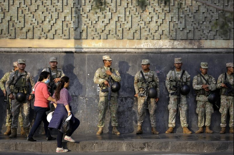 Soldiers stand guard on a street, in Lima, Peru, on Sunday, as ongoing protests and civil unrest continue following the removal of President Pedro Castillo. Photo by Bienvenido Velasco/EPA-EFE