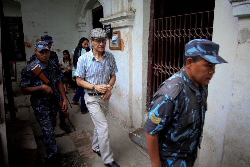 French serial killer Charles Sobhraj is escorted by Nepalese police after a court hearing in Kathmandu, Nepal, in 2011. Nicknamed "The Serpent," he is linked to a series of backpacker killings in Asia in the 1970s. File Photo by Narendra Shrestha/EFE