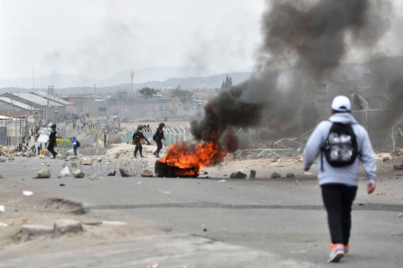 Members of the Police face demonstrators during a protest in the vicinity of the airport in the city of Arequipa, Peru on Monday. Photo by Jose Sotomayor/EPA-EFE