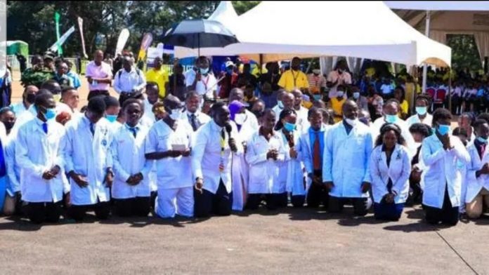 Ugandan doctors kneel to beg president