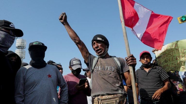 Demonstrators block a highway to Lima during a national transportation strike against gas prices and toll road rates, in Ica, Peru, 4 April 2022