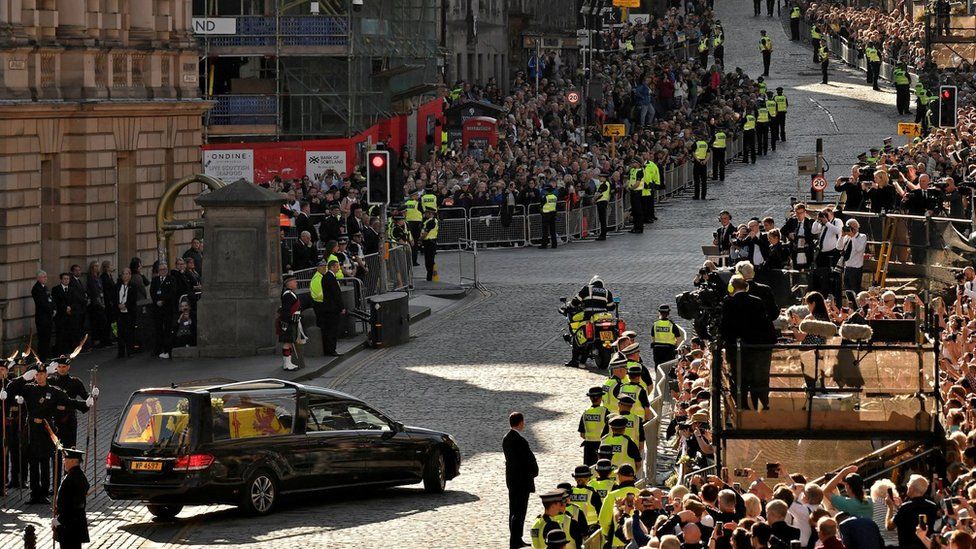 Crowds gather to watch the Queen's coffin leaving St Giles' Cathedral