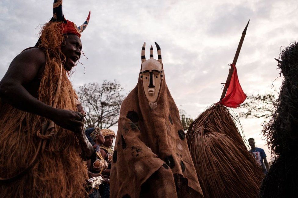 Performers take part in a parade during the Dakar Carnival in Dakar, Senegal on 26 November, 2022. - Each year at the end of November the Dakar Carnival is held in the capital celebrating modern cultural heritage with people coming and parading in their local traditional dress from around Senegal.