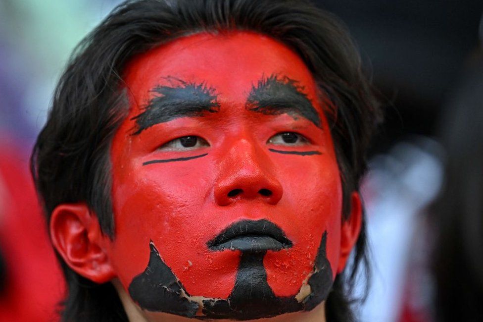 A South Korea fan attends the Qatar 2022 World Cup Group H football match between South Korea and Ghana at the Education City Stadium in Al-Rayyan, west of Doha, on November 28, 2022.