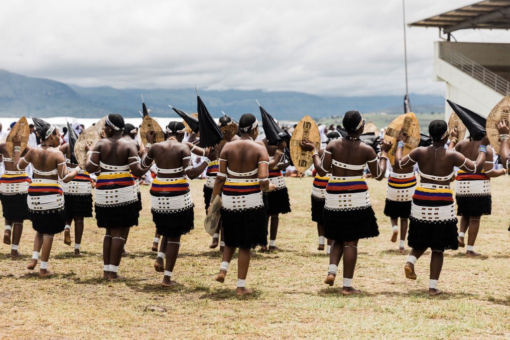 Women from the Nazareth Baptist Church, known as the Shembe Church, dressed in traditional attire, dance on the second day of the annual prayer and reconciliation ceremony at the Enyokeni Zulu Royal Palace in Nongoma, some 400 kilometres north of Durban, on November 27, 2022.