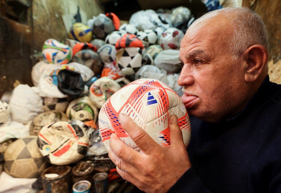 Mostafa Mahmoud, 68 years old, fixes and makes football balls, he has been doing it since 50 years ago, in Cairo, Egypt, November 30, 2022.