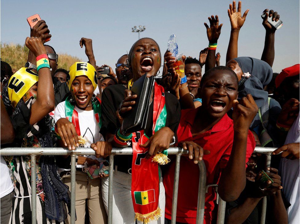 Fans in Dakar watch Ecuador v Senegal - Dakar, Senegal - November 29, 2022 Senegal fans celebrate during the match.