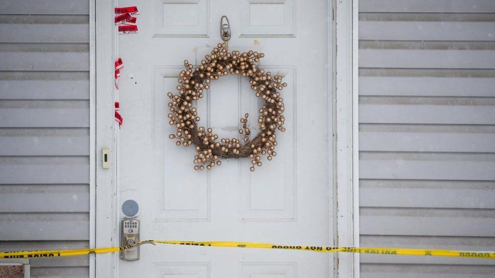 Evidence tape is seen around the door of the residence where four University of Idaho students were killed in Moscow
