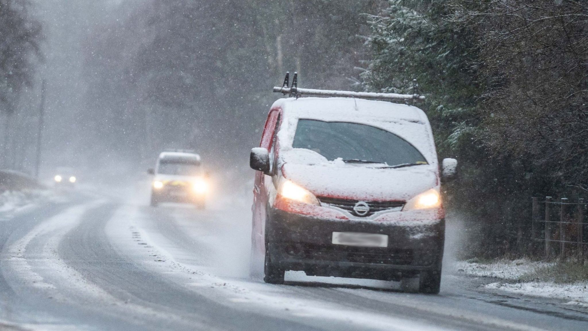 Cars drive in snow near Lumsden, Aberdeenshire