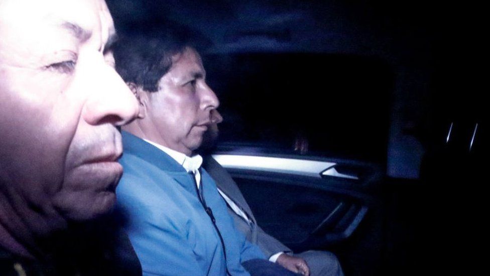 Former President Pedro Castillo seen inside a police car in Lima