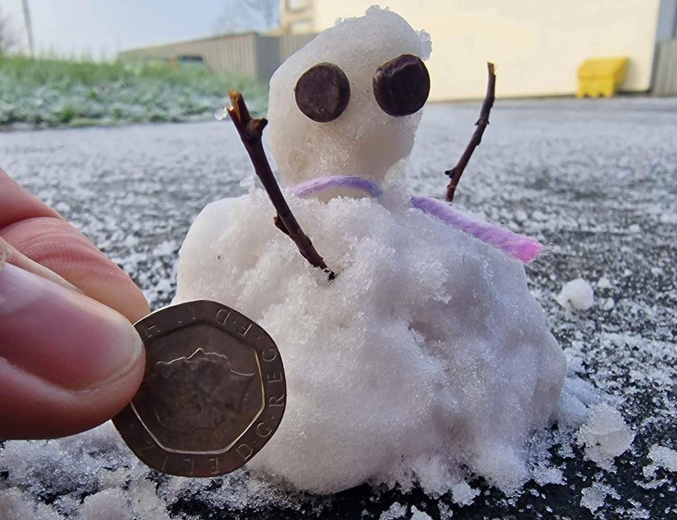 1st snowman of the season. By 8 year old Phoebe Dickson in Carryduff