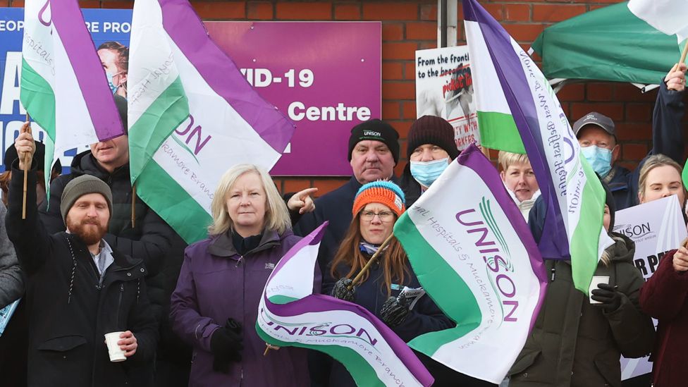 Unison members strike outside the Royal Victoria Hospital in Belfast