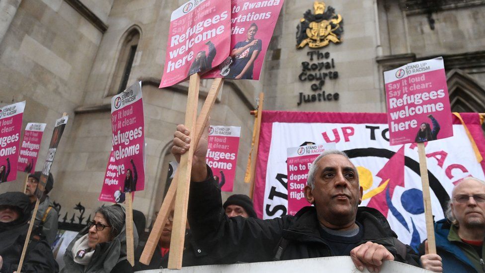People protest outside the Royal Courts of Justice on Monday