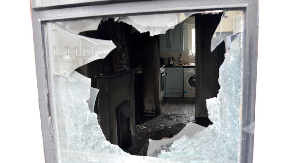 Smashed window at the scene of Ballymena petrol bomb attack