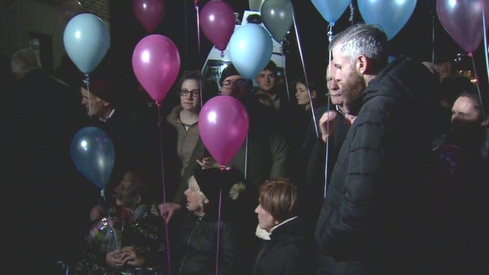 Pink and blue balloons were released into the air in memory of the expectant mother