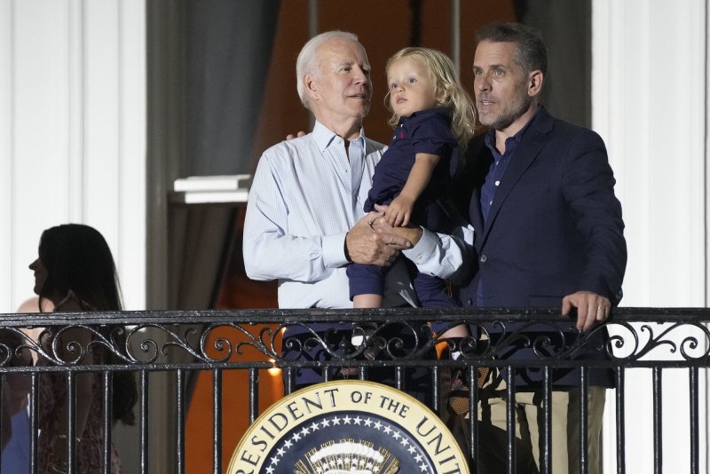 President Joe Biden stands with Hunter Biden and holds grandson Beau Biden as they watch fireworks from the Truman Balcony of the White House in Washington, D.C., at a celebration for military families on July 4. On Wednesday, House Republicans opened an investigation into the Biden family's business dealings. File Photo by Chris Kleponis/UPI