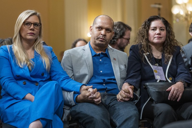 Sandra Garza (R) filed a wrongful death lawsuit against former President Donald Trump and two others this week over the death of her partner Capitol Police Office Brian Sicknick. File Photo by Pat Benic/UPI | <a href="/News_Photos/lp/6dc2058a91537dc2990d47c50c2bb68b/" target="_blank">License Photo</a>