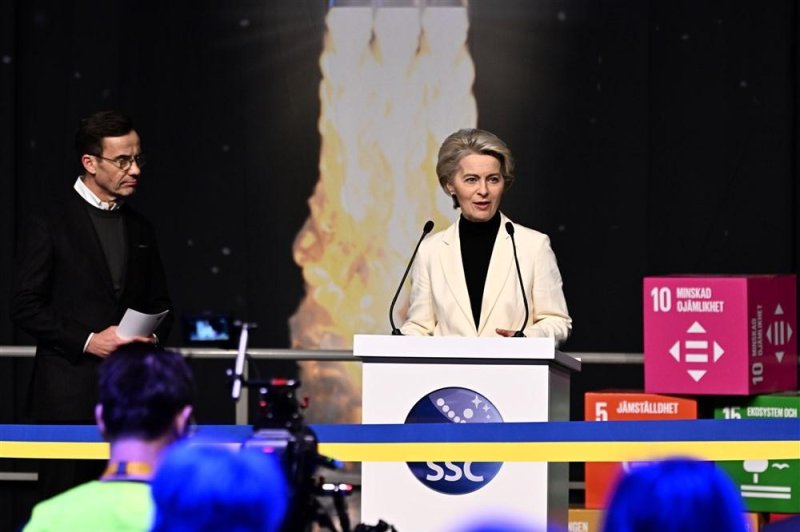 Sweden's Prime Minister Ulf Kristersson (L) watches European Commission President Ursula von der Leyen delivering a speech at the inauguration of the Spaceport Esrange's new satellite launch ramp outside Kiruna, Sweden on Friday. Photo by Jonas Ekstroemer/EPA-EFE