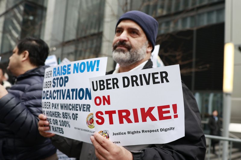 New York Taxi Workers Alliance Uber drivers hold rally outside the rideshare app's corporate headquarters in Manhattan on Thursday as part of a 24-hour strike in response to the company legal efforts to block pay raises. Photo by John Angelillo/UPI | <a href="/News_Photos/lp/fb3aa22099694c0a7cc63fad87f775ac/" target="_blank">License Photo</a>