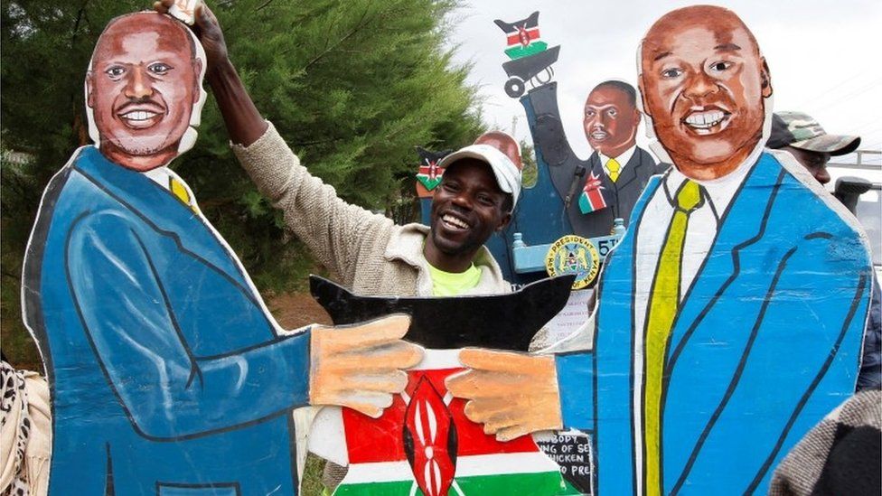 vendor holds an artistic expression representing Kenya"s President-elect William Ruto and his deputy Rigathi Gachagua outside his official residence in Karen district of Nairobi, Kenya, August 17, 2022.
