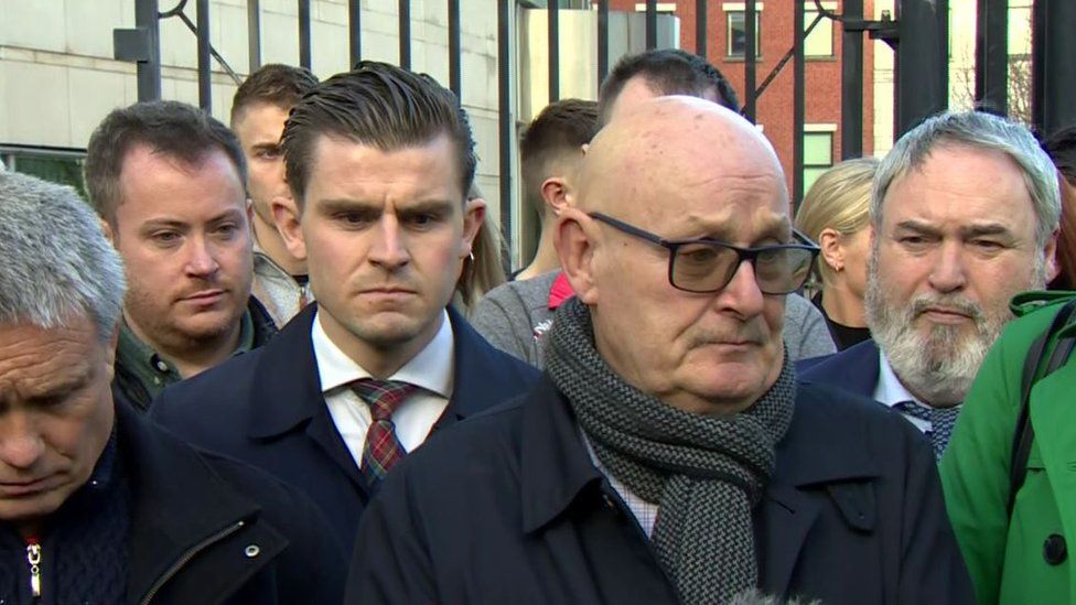 Aidan McAnespie's brother Sean, seen wearing glasses, with supporters outside court in November