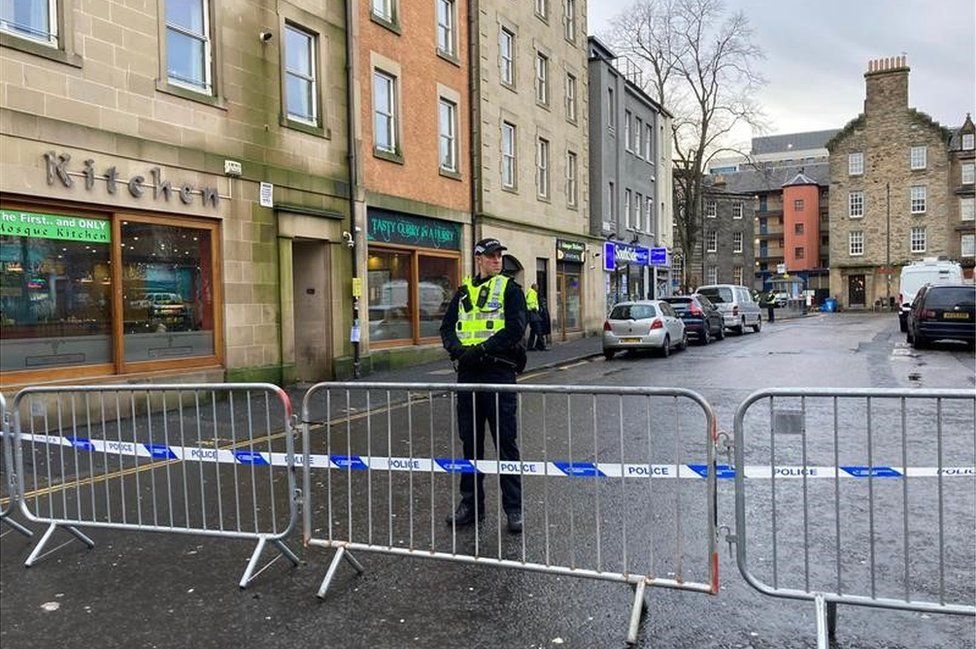 Police officer standing guard near Edinburgh Mosque