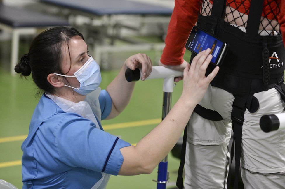 Physiotherapist Claire Lincoln with patient Luke Louden on the ZeroG Gait and Balance System
