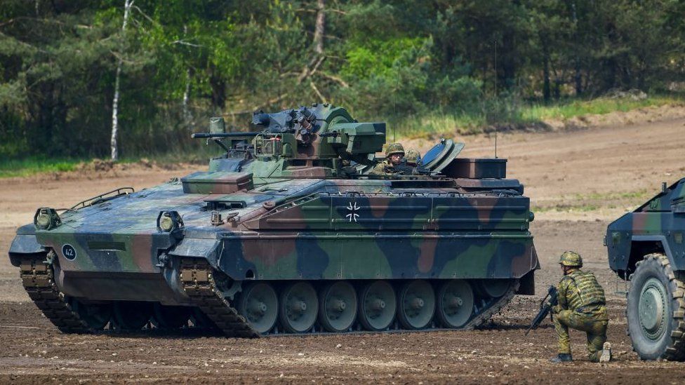 A Marder battle tank of the German armed forces Bundeswehr drives during an informative educational practice of the "Very High Readiness Joint Task Force (VJTF)", which is part of a NATO tank unit, at the military training area in Munster, northern Germany, on May 20, 2019