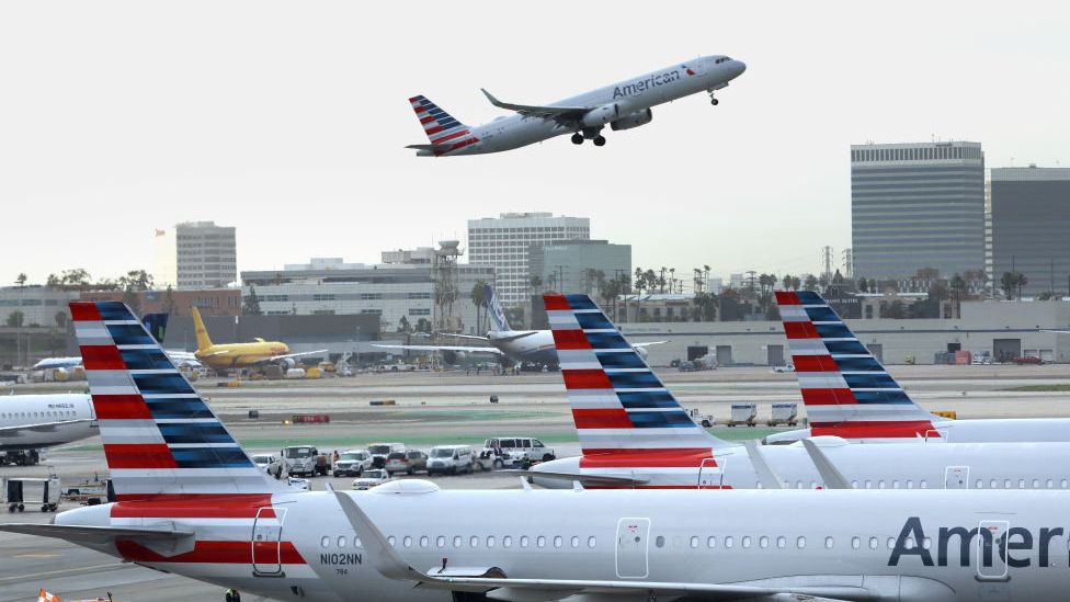 Photo of an American Airlines flight preparing to take off at LAX on 11 January after a computer problem grounded flights across the US