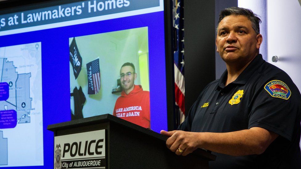 Police Chief Harold Medina in front of a photo of Mr Pena