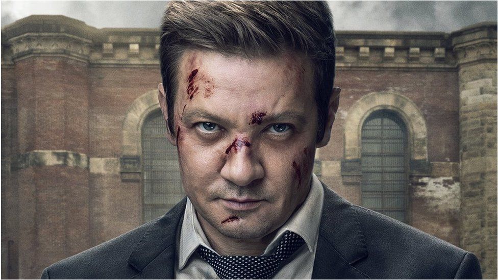 Jeremy Renner with cuts on his face in the original poster image for Mayor of Kingstown
