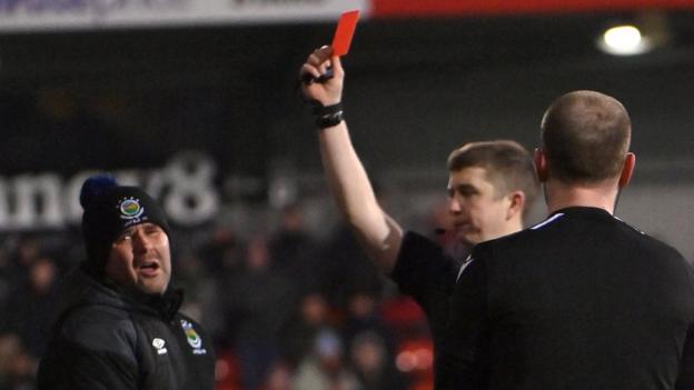 Linfield manager David Healy is red-carded by referee Shane Andrews at Seaview