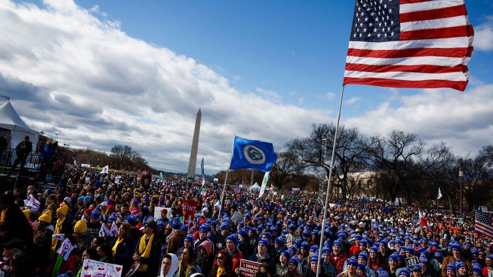 People listen during a rally for the 50th annual March for Life rally on the National Mall on January 20, 2023 in Washington, DC.