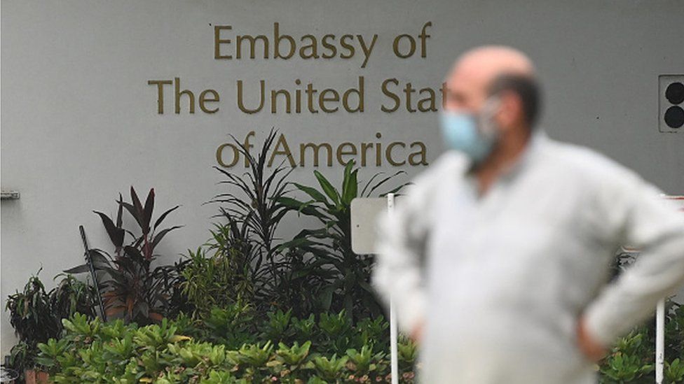 An man stands outside the US embassy in New Delhi