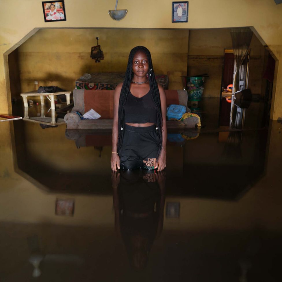 Gift Ikuru standing in flood water in her home in Ogbia Municipality, Bayelsa State, Nigeria - November 2022