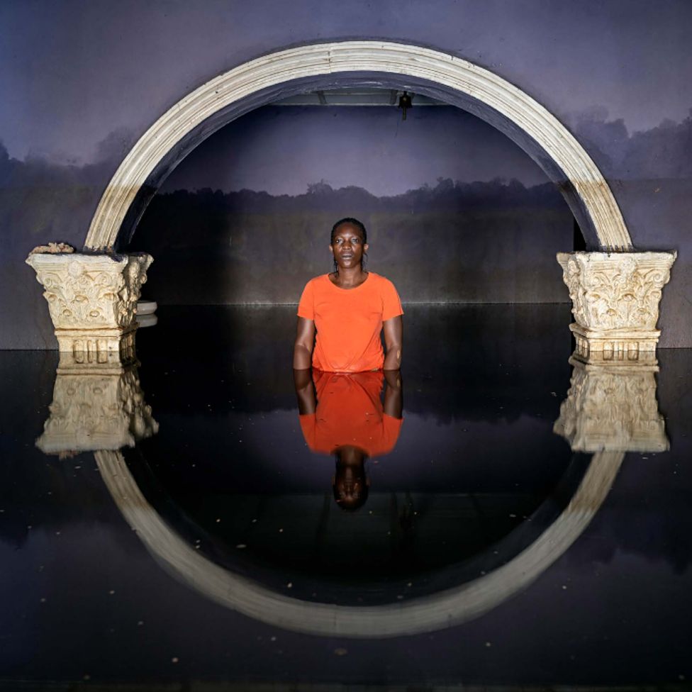 Eruabai Ase standing in flood water in her home in Ogbia Municipality, Bayelsa State, Nigeria - November 2022