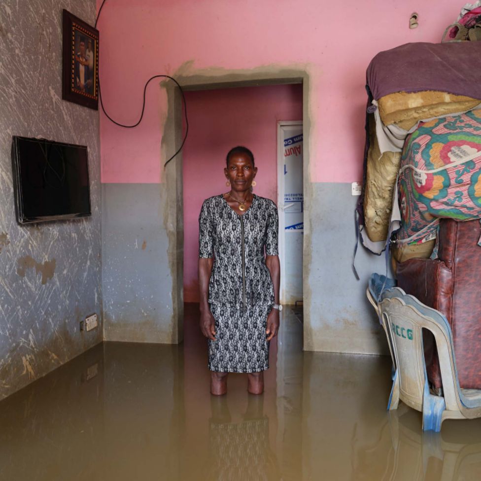 Orubo Oro standing in flood water in her home in Yenagoa Municipality, Bayelsa State, Nigeria - November 2022