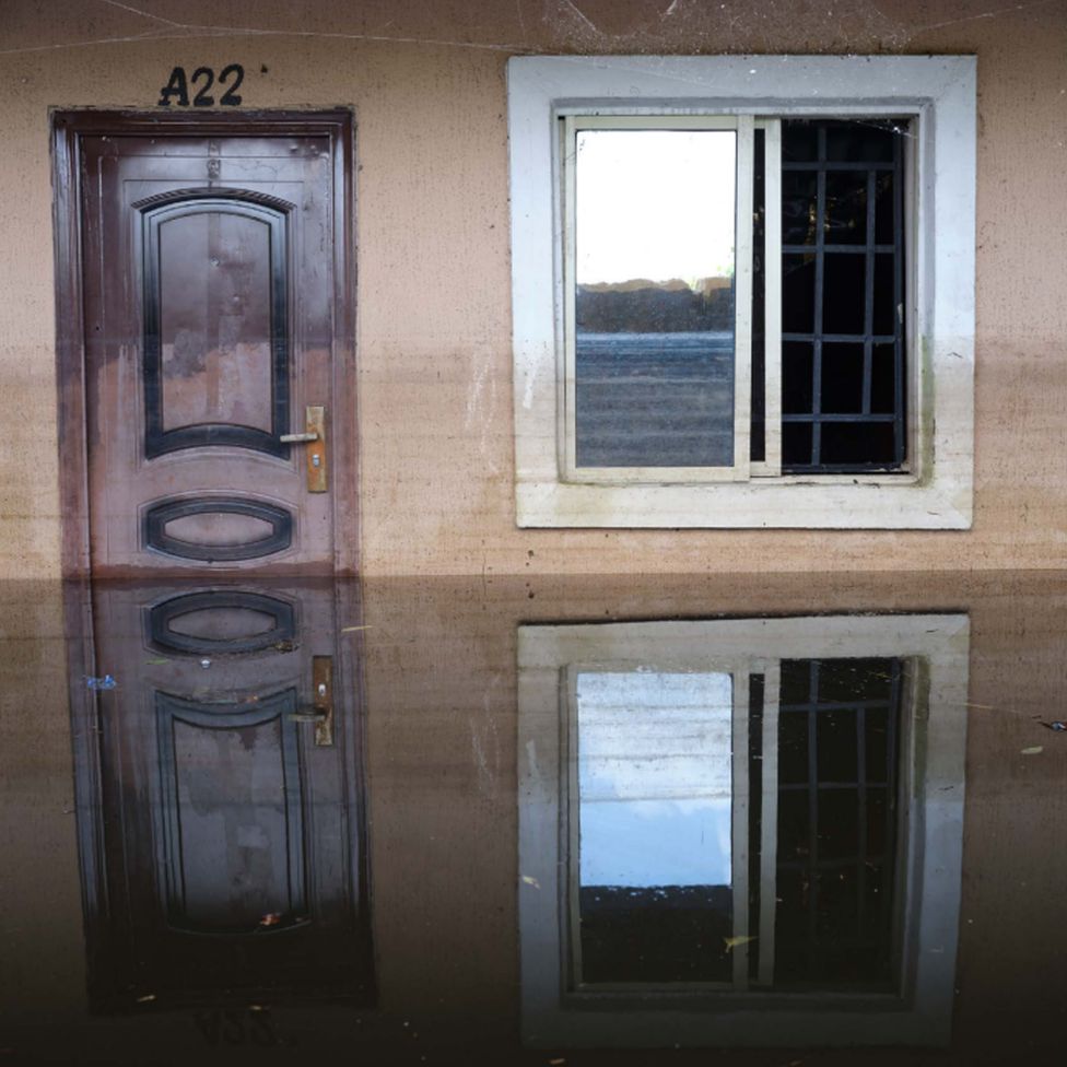 Floodwater outside a door at Dorca Executive Apartments (student accommodation) in Ogbia Municipality, Bayelsa State, Nigeria - November 2022