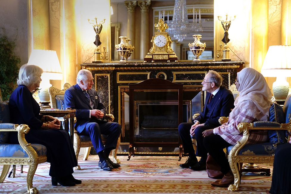 King Charles III and the Queen Consort meet with Holocaust survivor Dr Martin Stern and a survivor of the Darfur genocide, Amouna Adamlight