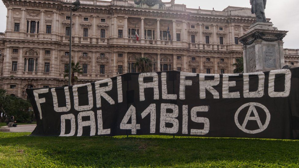 Demonstrators in front of the Court of Cassation hold up a banner during a demonstration by anarchists protesting against the 41-bis regime for Alfredo Cospito, an insurrectionist anarchist convicted of terrorist offences on January 25, 2023 in Rome, Italy.