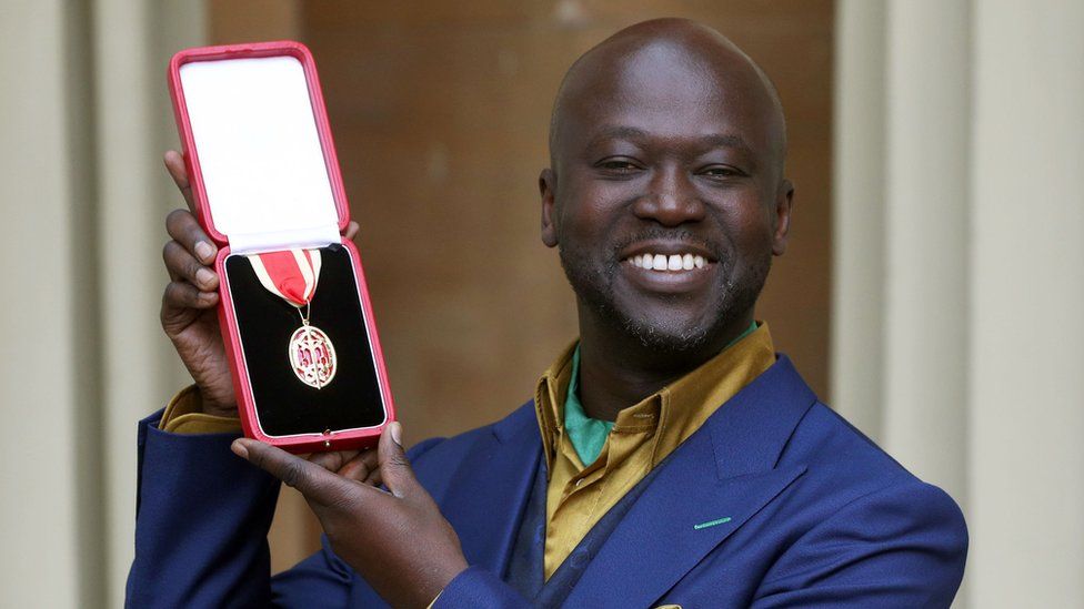 Sir David Adjaye poses after he was Knighted by the Duke of Cambridge during an Investiture ceremony at Buckingham Palace on May 12, 2017