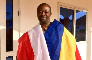 GFA president draped in flags of the two clubs