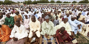 Muslims observing prayers outside