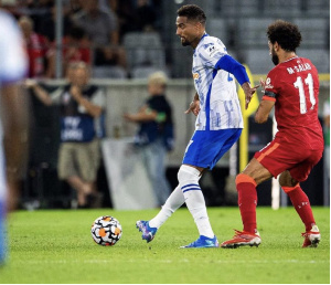 Kevin Prince Boateng wards off Salah during the game
